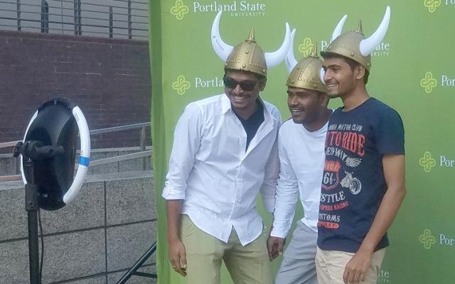 Three students taking a photo during welcome days in the plaza
