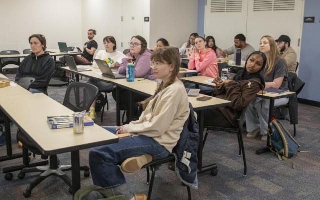 Portland State elementary education students listening to a presentation during a student teaching seminar
