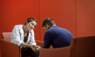 Counselor and student seated having conversation