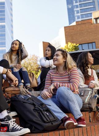 Students sitting in Urban Plaza