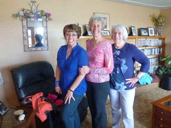The image is of three people posing. 