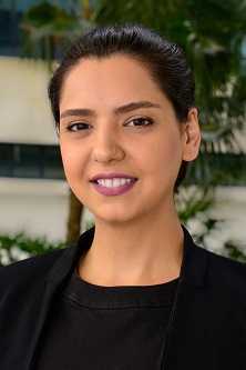 Headshot of Mitra Naseh, a dark-skinned woman with dark hair in an updo