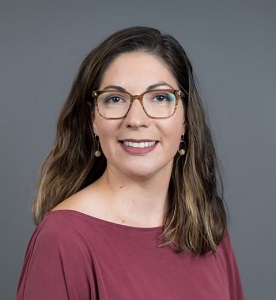 Professional photo of brown-haired woman with glasses