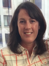 Image of Stephanie Sundborg, middle-aged white woman with dark brown hair, smiling.
