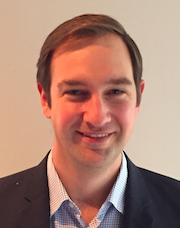 Picture of Samuel Edwards, a young white man in button down smiling.