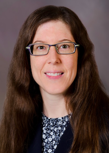 Image of Willi Horner-Johnson, a middle-aged white woman with long brown hair, smiling.