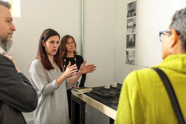 Woman teaching in front of students
