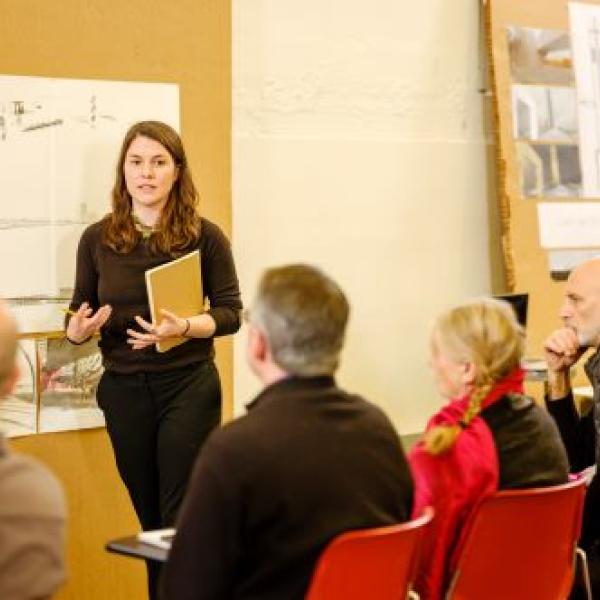 Woman teaching in front of students