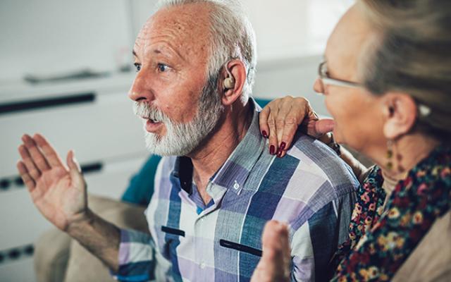 PSU Speech and Hearing researcher working with a client