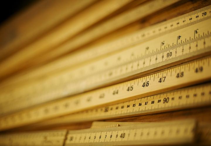 Photo of a pile of meter sticks up close