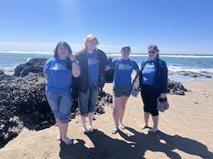 SCEC staff in front of the ocean