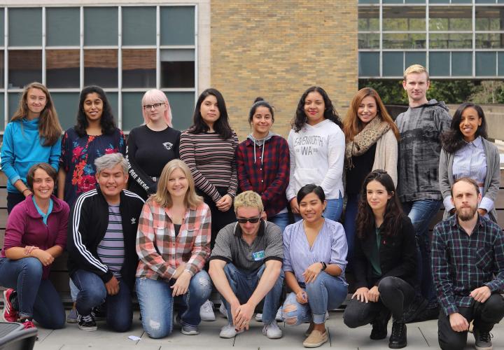 Fifteen students in the Student Leaders for Service program pose for a group shot in front of a PSU building