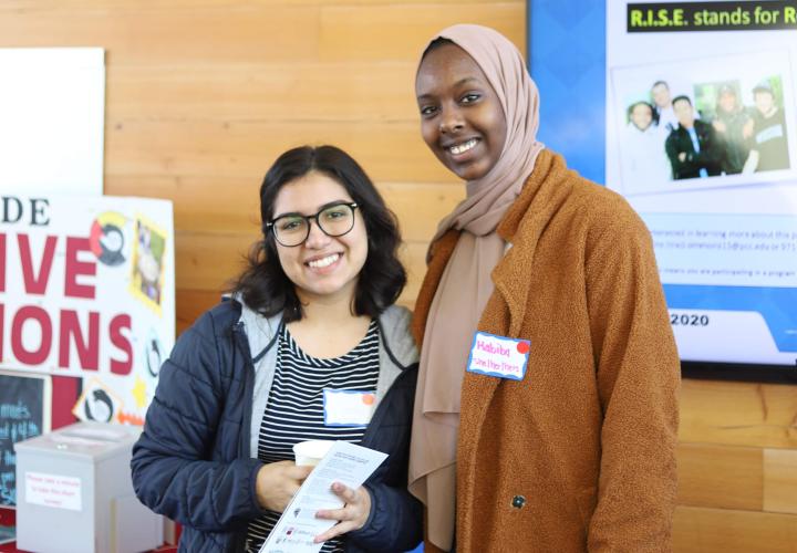 Two students at MLK Day of Service smile for the camera
