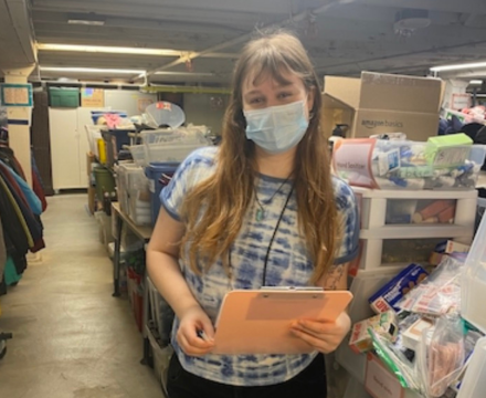 Girl holding clip board