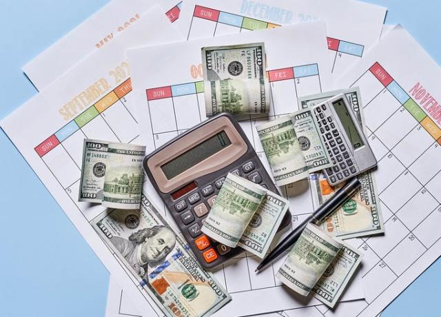 Stock image of money and calculator