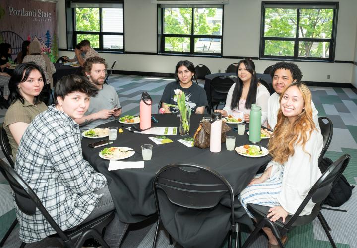 Students at a table during the spring leadership luncheon
