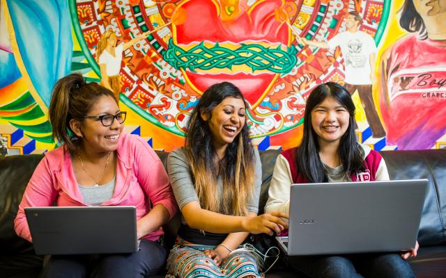 Three women laughing