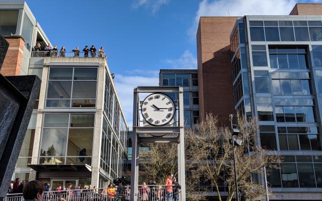 A large group of people listening to a speaker in the Urban Plaza, 2018