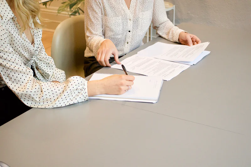 People Signing Papers