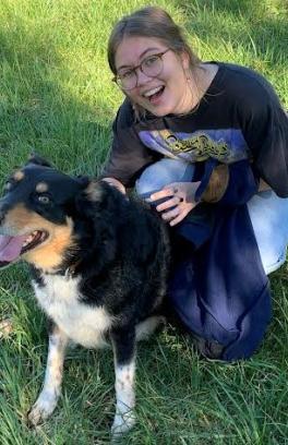 SLS student worker Sofia Boone poses with her dog
