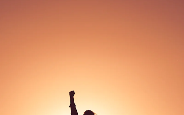 Survivor holding up fist