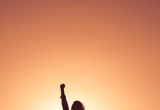 Survivor holding up fist