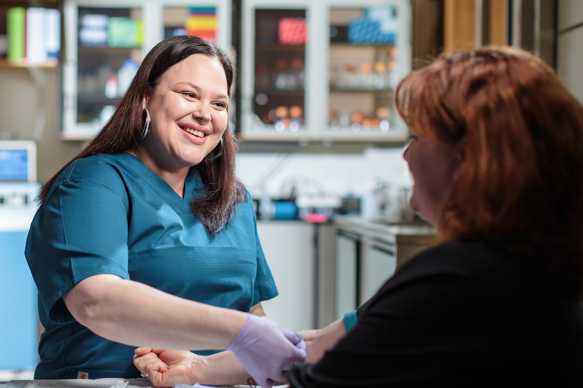 Student helping a patient