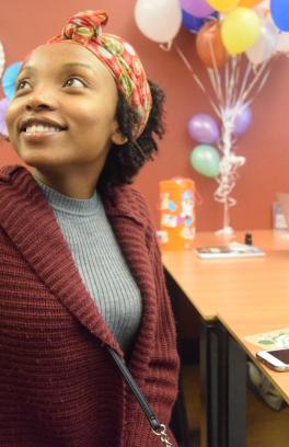 Student looking up from a table.