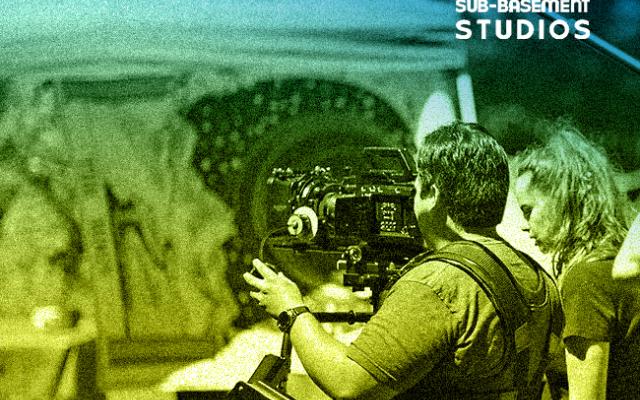 Sub Basement Studios logo over students using a camera