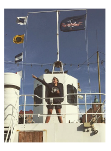 Kimberly Gottschalk standing on the bridge of a boat