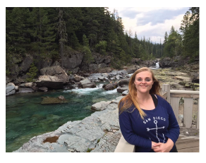 Jennifer Mick standing next to a rocky river