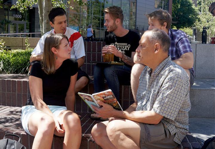 Students gather and discuss