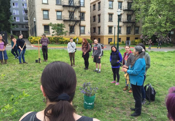 Indigenous Nations Studies Faculty leads traditional planting in the Oak Savanna green space on campus.