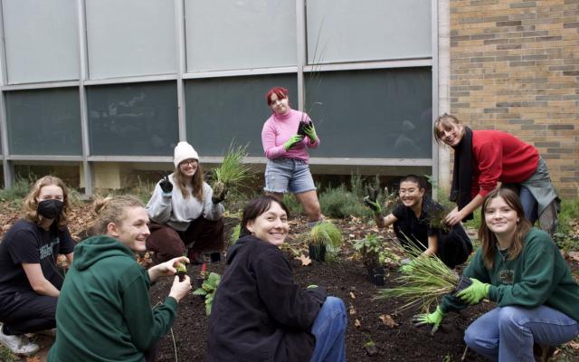 Eight people are shown smiling and gardening.