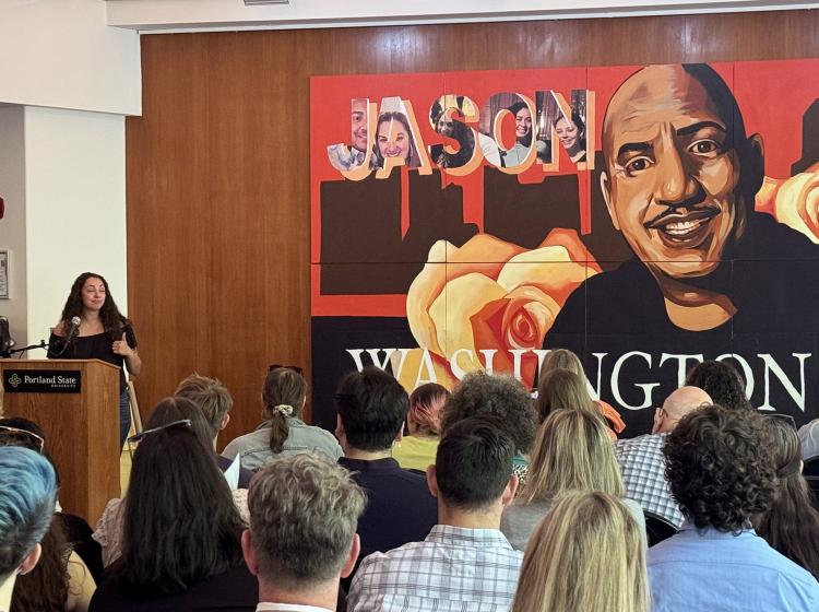 Jason Washington's daughter Kayla speaks at his mural unveiling in the study lounge of Smith.