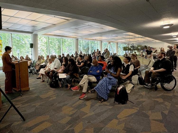 Campus and community members gather at the Jason Washington mural unveiling in June 2024.