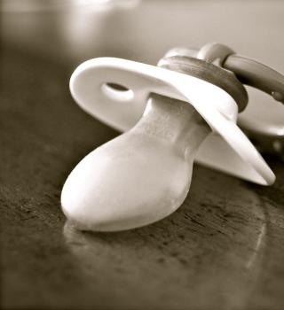 A pacifier on a table.