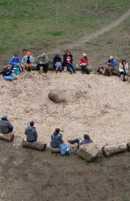 Students sitting in a circle in the White Oak Savannah 