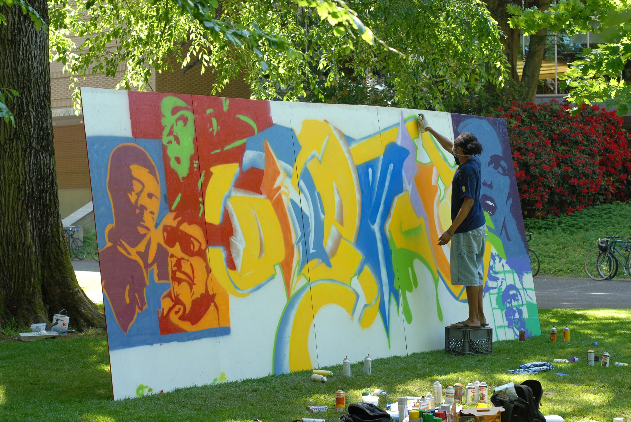 picture of a person painting a graphic mural 