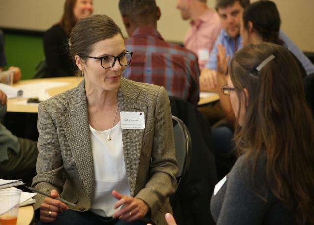 PSU Assistant Professor Kelly Gleason talks with a student