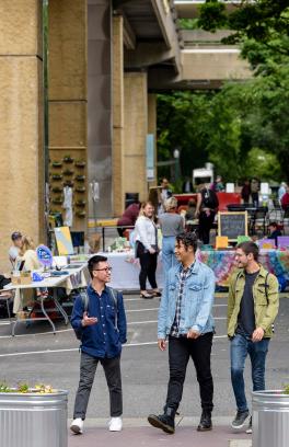 Students walk through a busy Montgomery Plaza