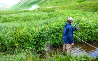 USGS Researchers Measuring Steam Discharge at Akutan Volcano in Alaska