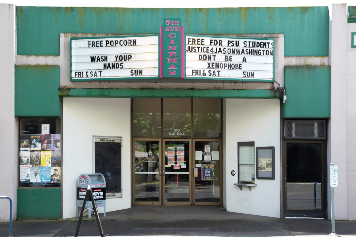 Fifth Avenue Cinema front doors and marquee sign