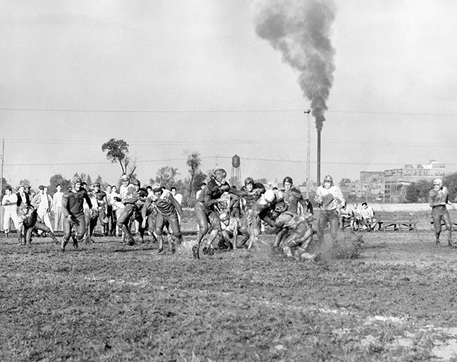 Vanport football in the mud, accentuated by aromas from the nearby smokestack of the meat-packing plant.