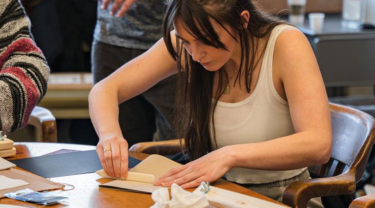 Students participating in a book-making workshop