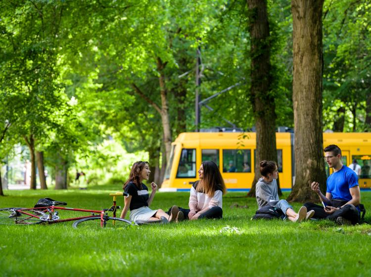 Students in Park Blocks with streetcar