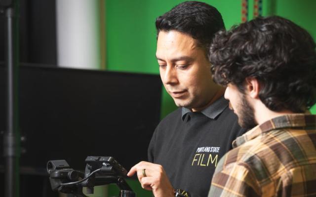 LAIKA Faculty Fellow J.J. Vazquez mentors a PSU film student on camera equipment