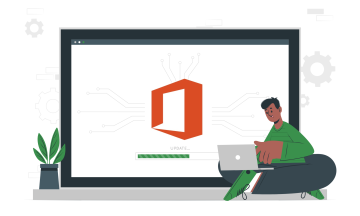 Technician working at laptop next to larger laptop showing a Microsoft Office upgrade