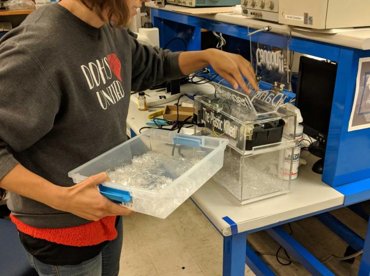 Teacher Heather Blair setting up an experiment