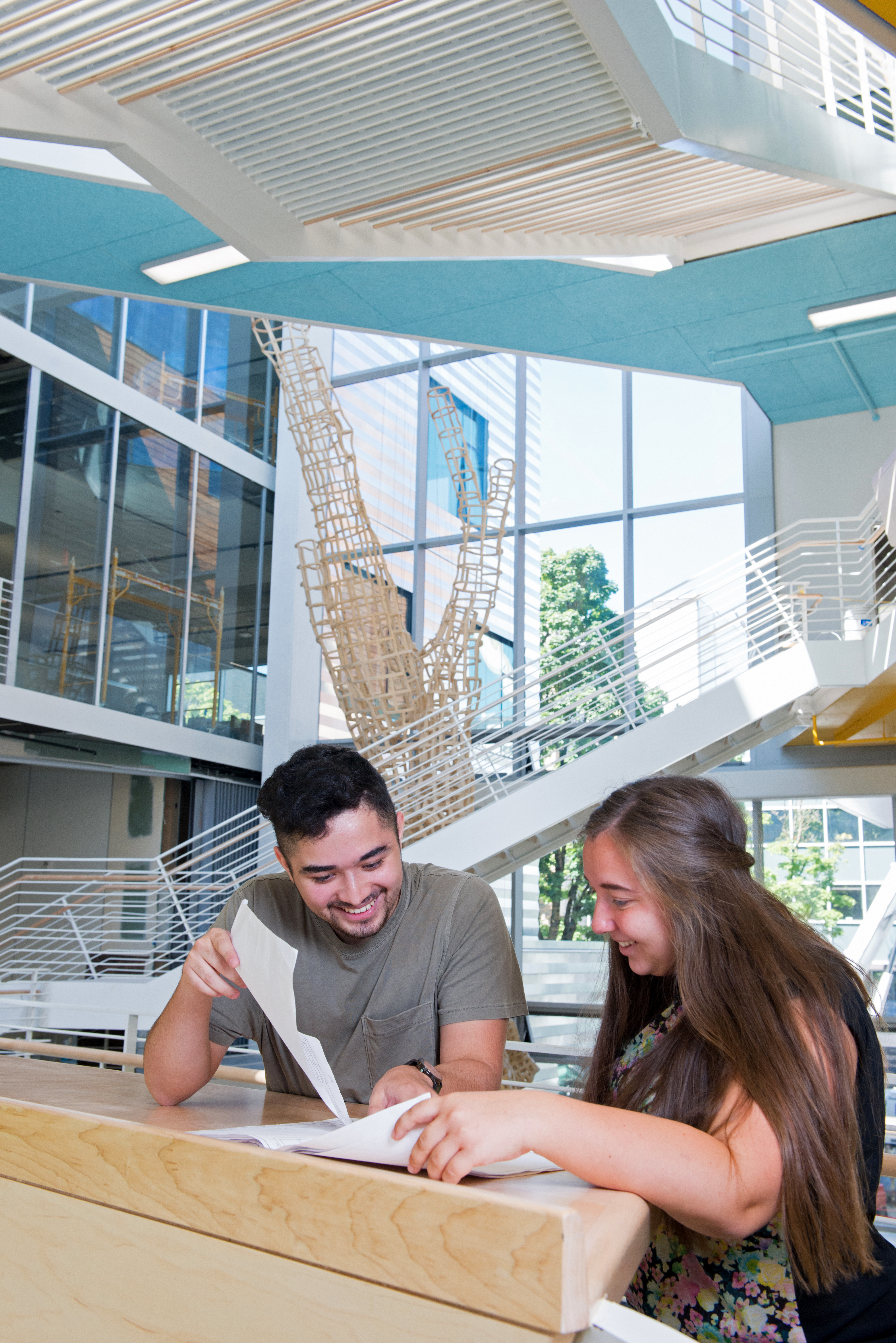 two people working together in KMC atrium